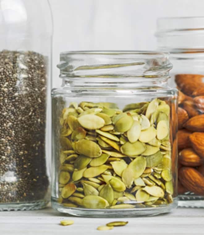 Glass jars with seeds and nuts