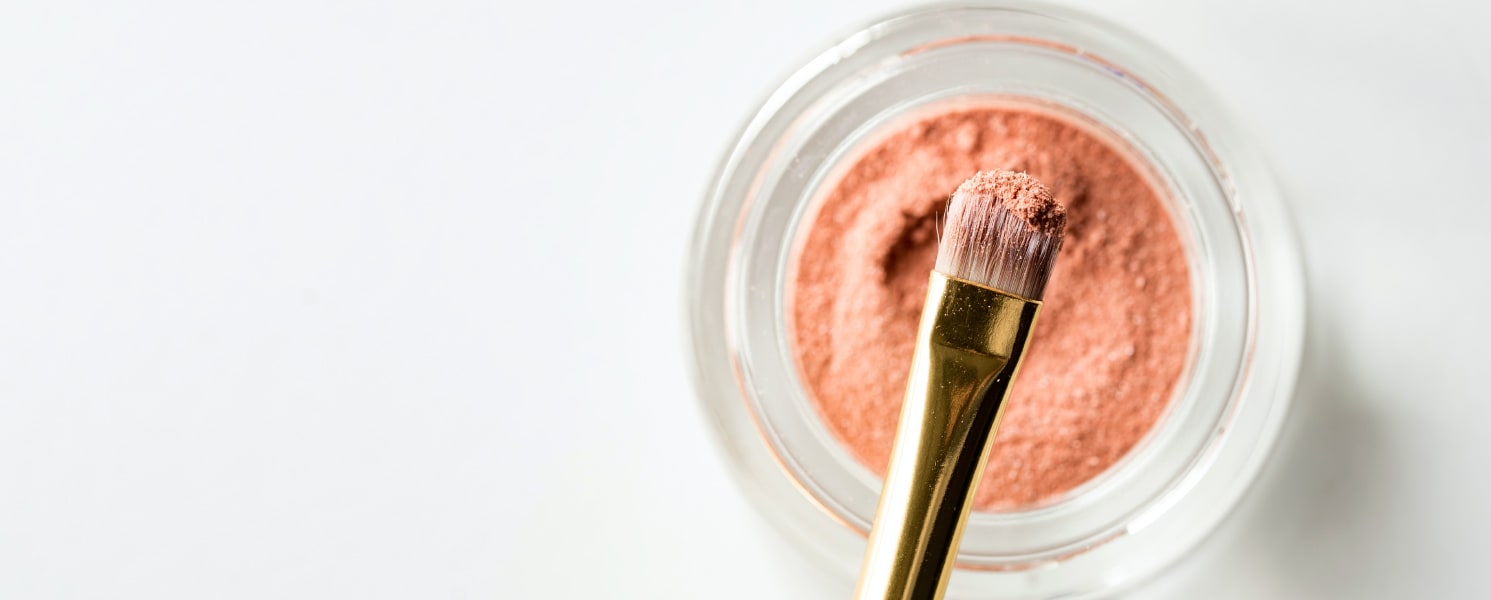 Pink makeup and brush