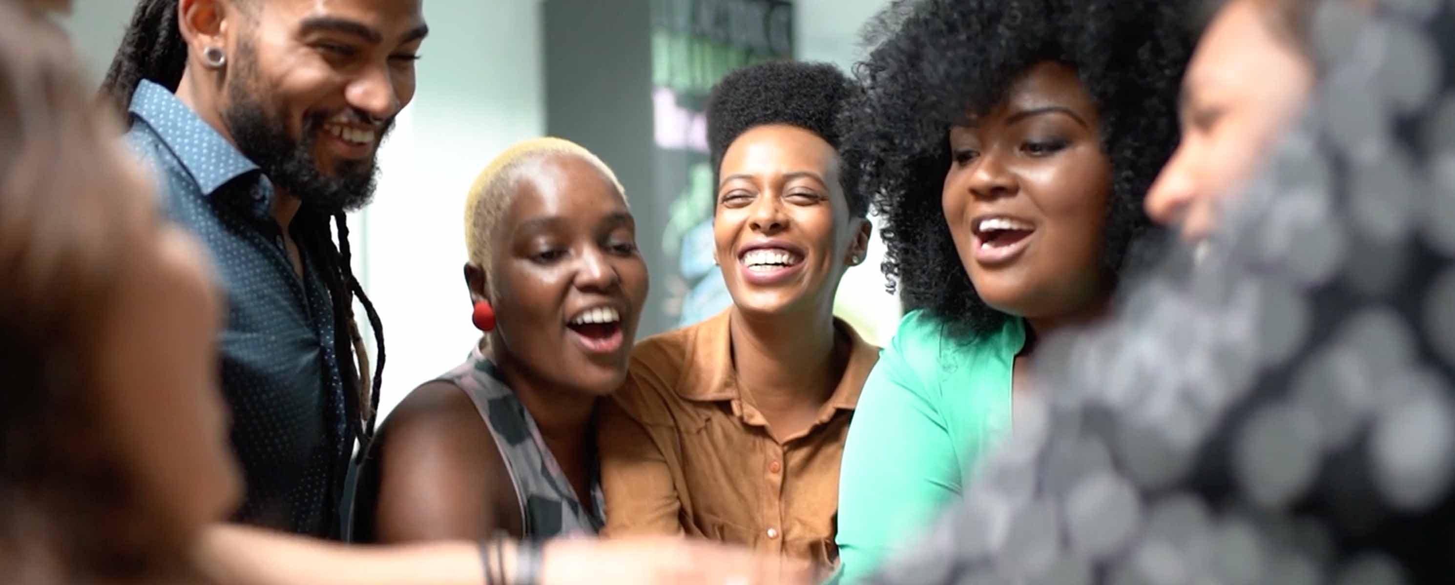 Group of young black adults laughing