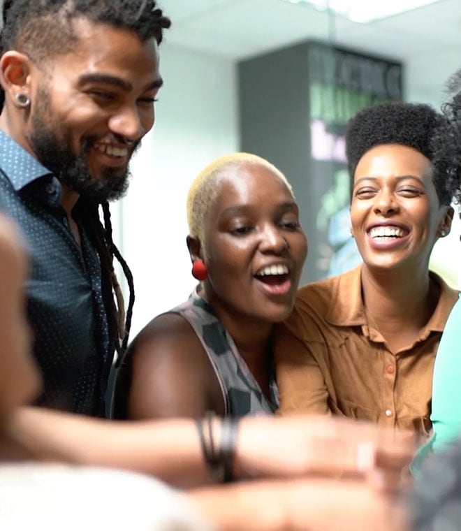 Group of young black adults laughing