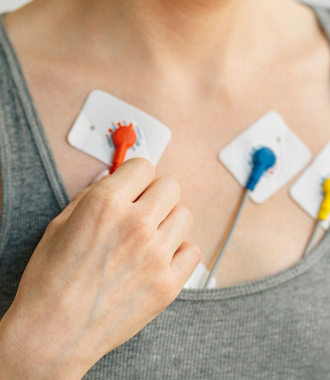 Heart monitor pads on a woman's chest