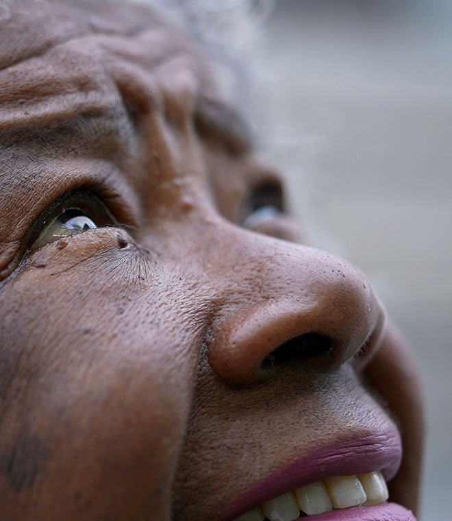 Older black woman looking up to the sky