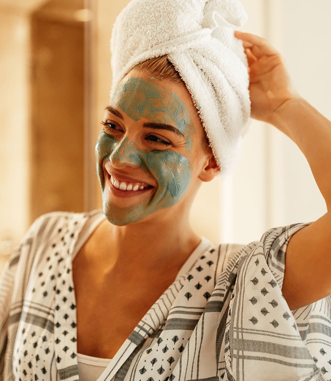Woman smiling in a face mask