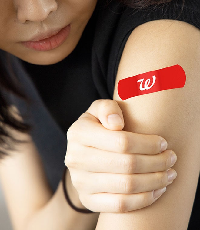 Woman with a walgreens bandaid on her arm