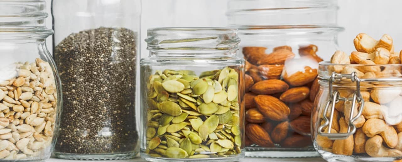Glass jars with seeds and nuts
